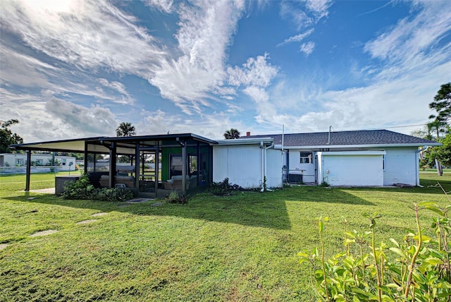 view of front of property featuring a sunroom and a front yard
