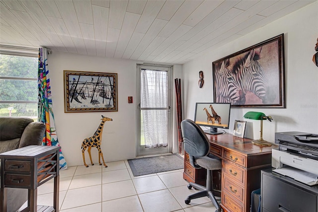 home office with plenty of natural light and light tile patterned floors