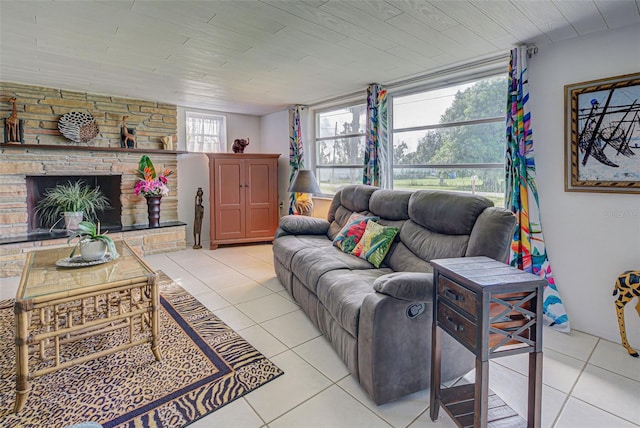 living room featuring light tile patterned floors and a fireplace