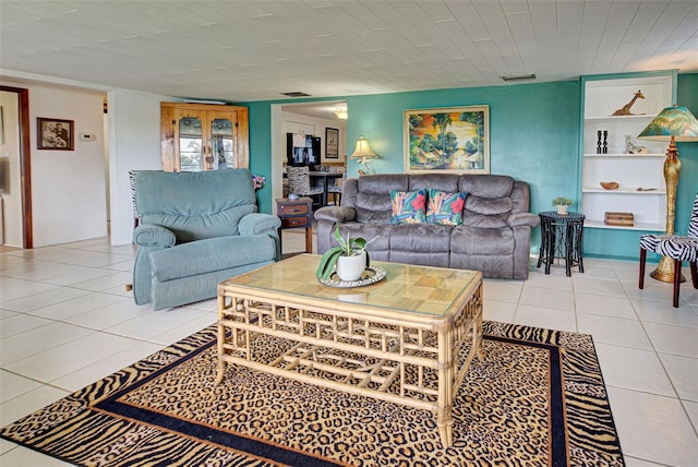 living area with visible vents and tile patterned floors