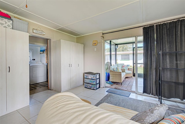 tiled living room with washer / clothes dryer