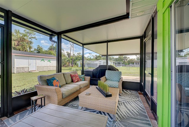 sunroom with plenty of natural light and an outdoor hangout area