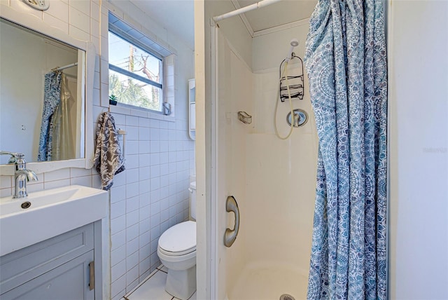 bathroom featuring vanity, tile walls, a stall shower, and toilet