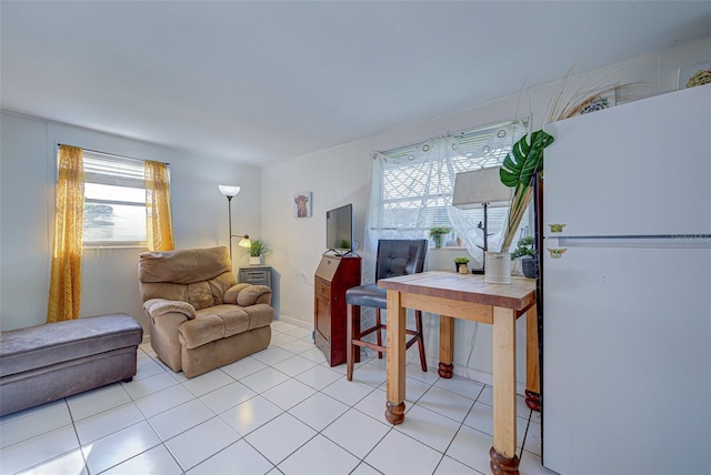 living area featuring light tile patterned floors