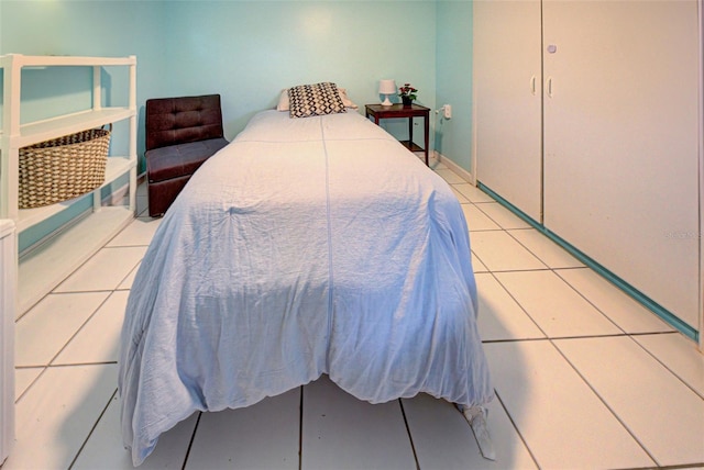 bedroom featuring light tile patterned flooring