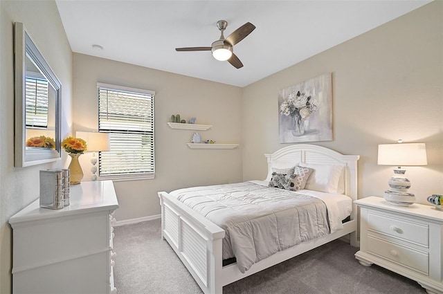 bedroom with ceiling fan and light colored carpet