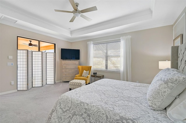 carpeted bedroom featuring ornamental molding, a raised ceiling, and ceiling fan