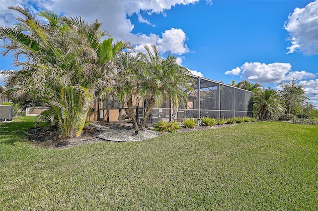 view of yard with a lanai