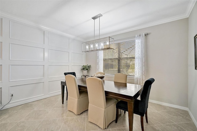 dining room with ornamental molding, a decorative wall, baseboards, and light tile patterned floors