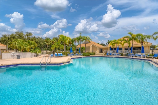 view of swimming pool with a patio area