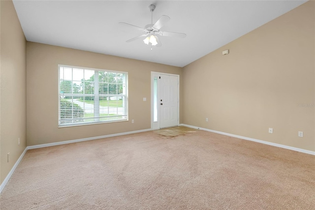 carpeted empty room with ceiling fan