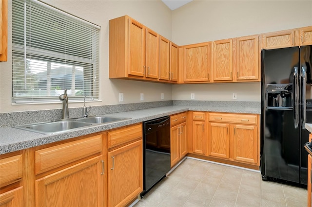 kitchen with sink and black appliances