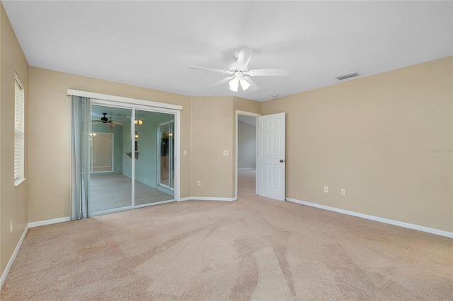 unfurnished bedroom with ceiling fan and light carpet