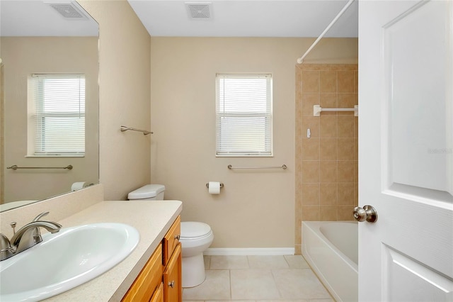 full bathroom featuring tile patterned flooring, vanity, toilet, and plenty of natural light