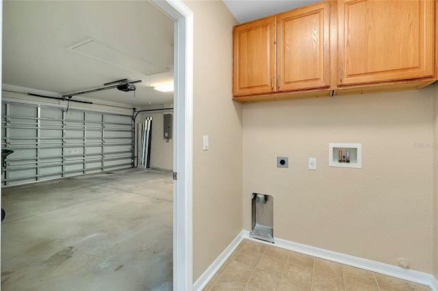 interior space featuring electric dryer hookup, electric panel, hookup for a washing machine, and cabinets