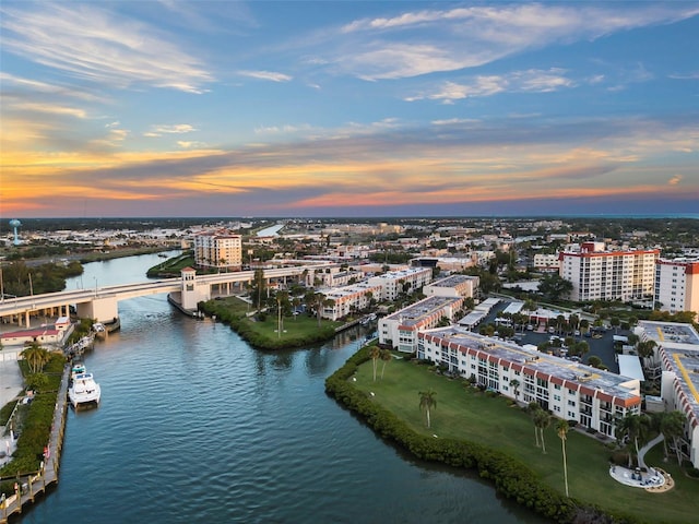 aerial view at dusk with a water view