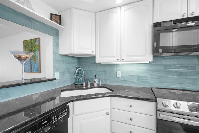 kitchen featuring dark stone counters, white cabinetry, sink, and black appliances