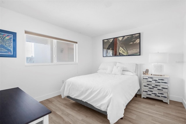 bedroom with light hardwood / wood-style flooring