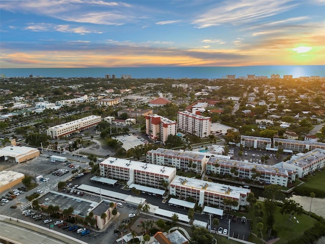 aerial view at dusk with a water view