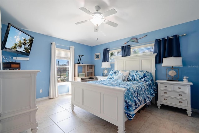 tiled bedroom with ceiling fan