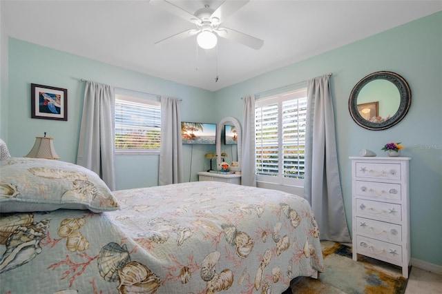 carpeted bedroom with multiple windows and ceiling fan