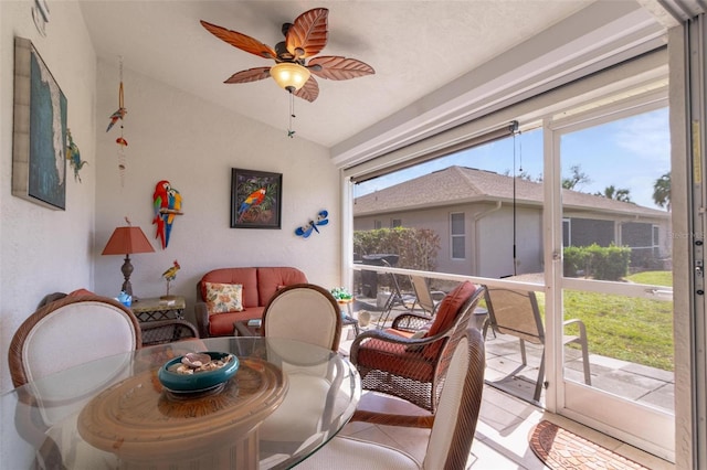 dining space featuring ceiling fan, lofted ceiling, and a wealth of natural light