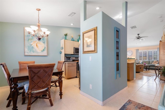 tiled dining room with lofted ceiling and ceiling fan with notable chandelier