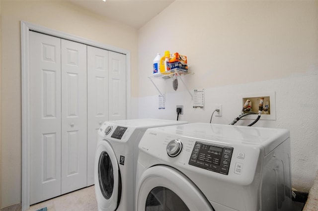 washroom featuring washer and dryer and light tile patterned floors