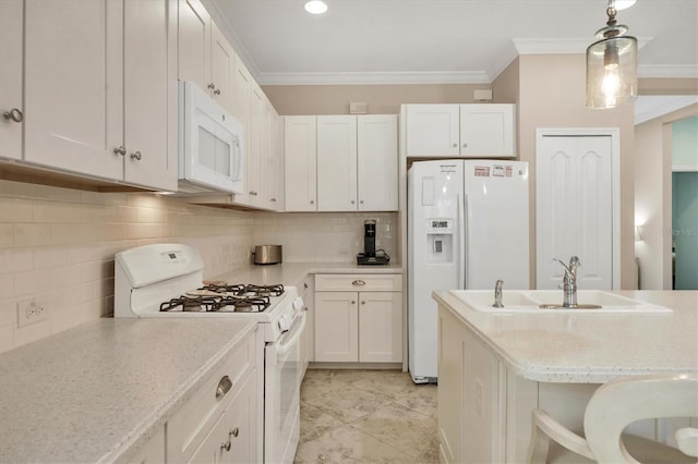 kitchen featuring white cabinetry, pendant lighting, and white appliances