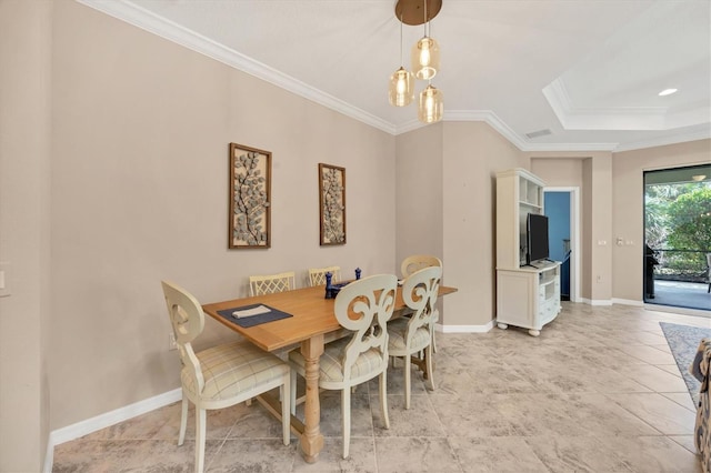 dining room featuring crown molding and a chandelier