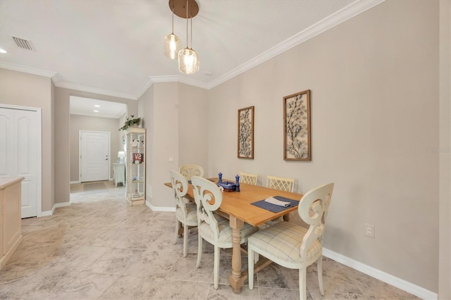 dining room featuring ornamental molding