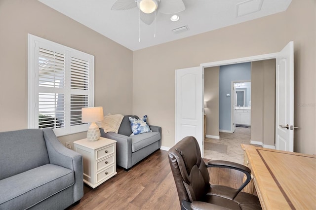 office area with hardwood / wood-style flooring and ceiling fan