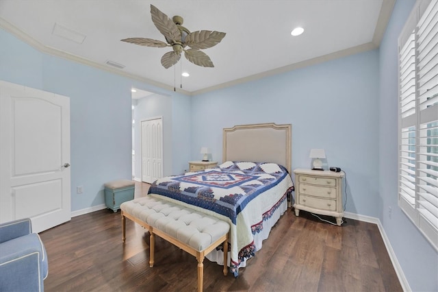 bedroom featuring a closet, ornamental molding, dark wood-type flooring, and ceiling fan