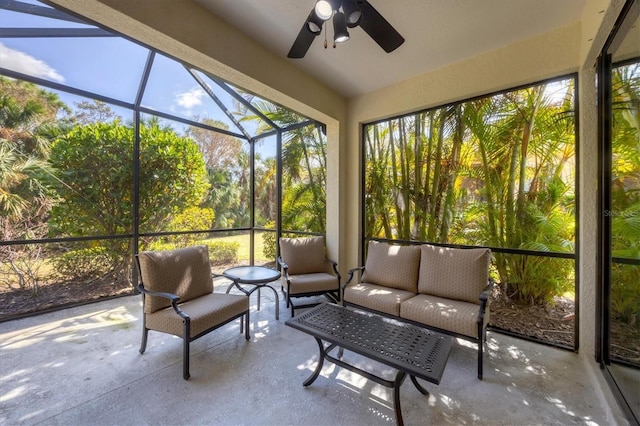 sunroom / solarium featuring lofted ceiling and ceiling fan