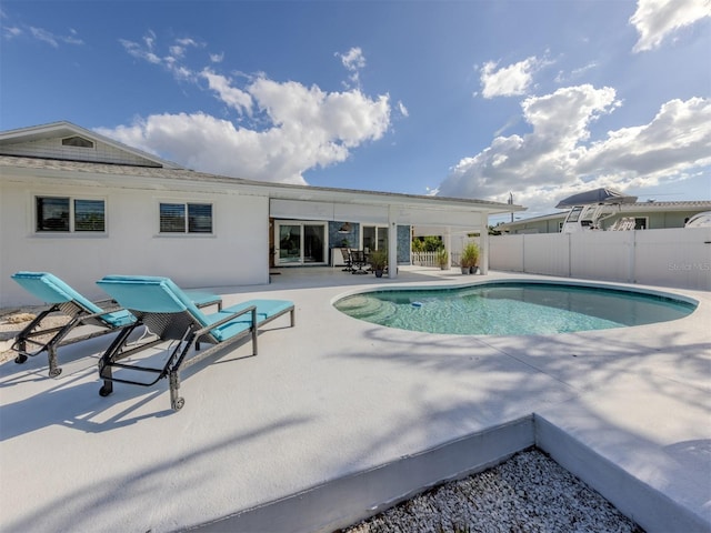 view of swimming pool featuring a patio area