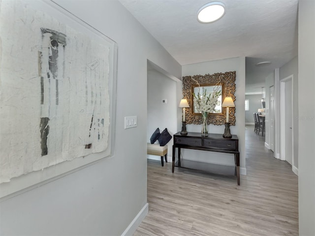 hallway featuring light hardwood / wood-style flooring