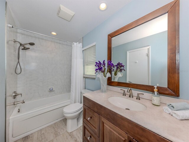 full bathroom with vanity, toilet, and shower / bathtub combination with curtain