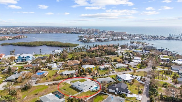 birds eye view of property featuring a water view