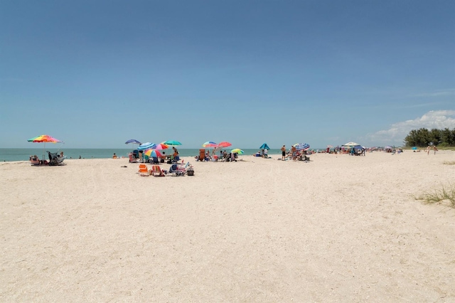 property view of water featuring a beach view