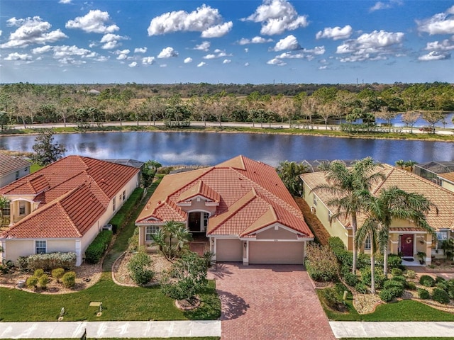 birds eye view of property with a water view