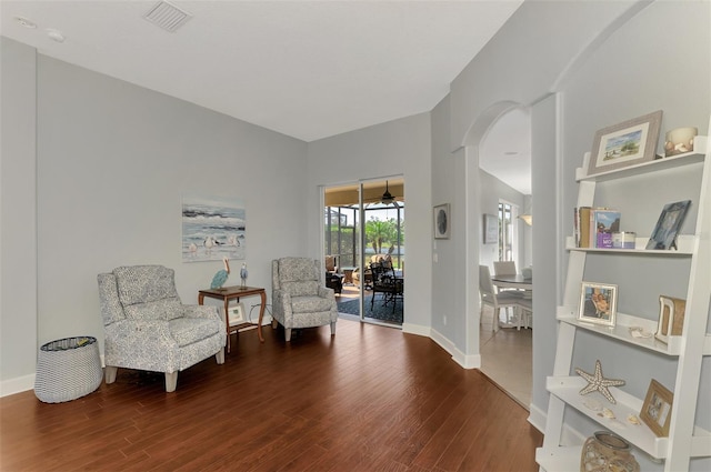 sitting room with hardwood / wood-style flooring