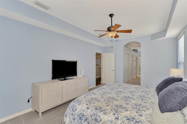 bedroom with ceiling fan and light colored carpet