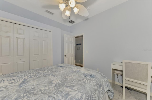 carpeted bedroom featuring a closet and ceiling fan