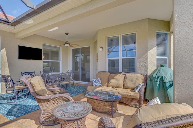 view of patio / terrace with an outdoor living space, area for grilling, and ceiling fan