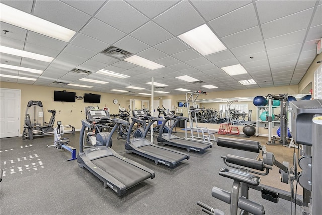 exercise room featuring a drop ceiling