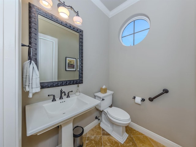 bathroom featuring tile patterned flooring, ornamental molding, and toilet