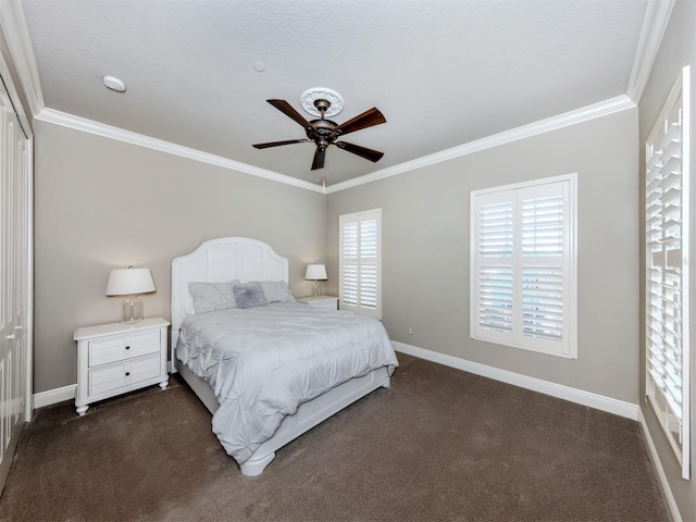 bedroom featuring ceiling fan, a closet, dark carpet, and ornamental molding