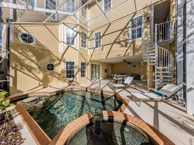 view of swimming pool with an in ground hot tub and a patio