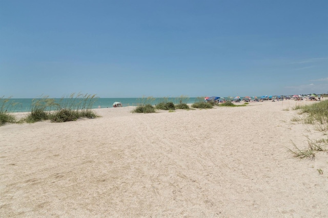 property view of water featuring a beach view