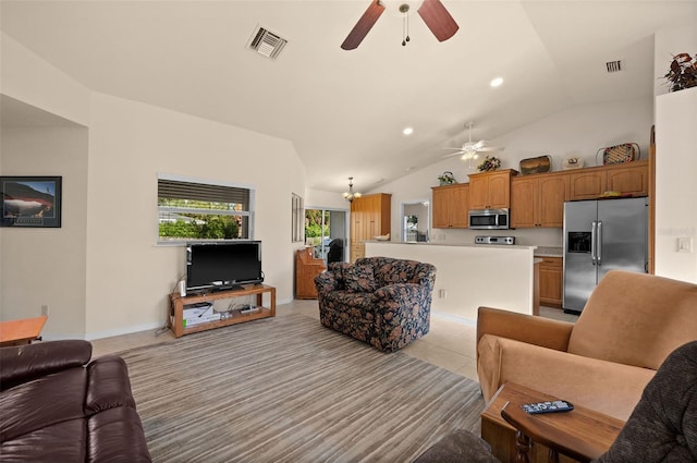 tiled living room with vaulted ceiling and ceiling fan with notable chandelier